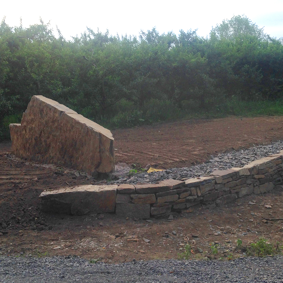 stone landscaping with stone wall